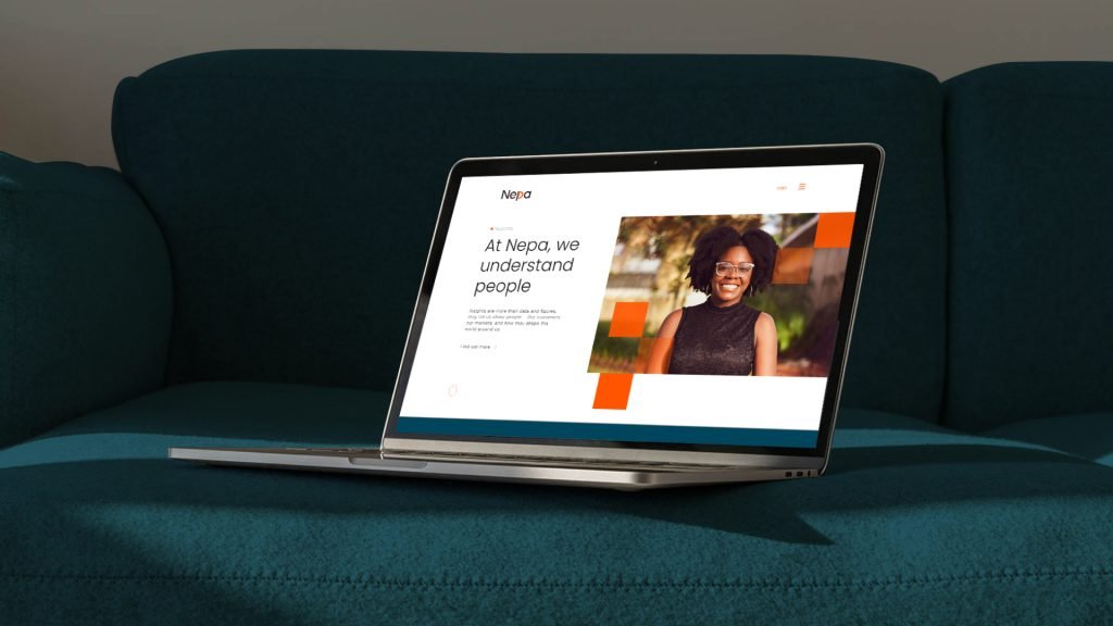 NEPA visual identity laptop on sofa